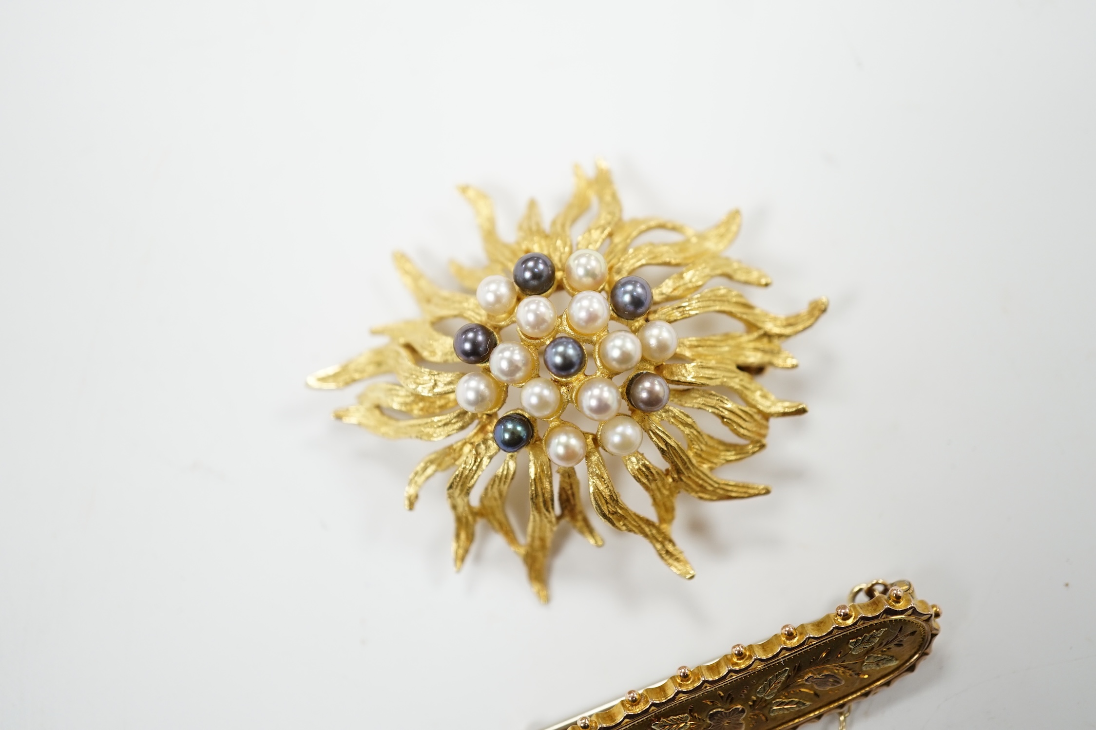 A continental 750 yellow metal and cultured pearl cluster set brooch, 44mm, gross weight 11.5 grams, together with a late Victorian three colour gold bar brooch, gross 2.4 grams.